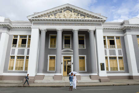 Cienfuegos, Cuba - 18 january 2016: People walking in front of San Lorenzo school building. The old town is a UNESCO World Heritage Site.のeditorial素材