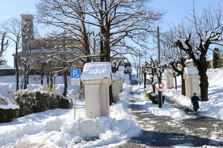 Breganzona, 6 march 2016: woman walking with her dog on the via crucis of the church at Breganzona near Lugano on Switzerlandのeditorial素材