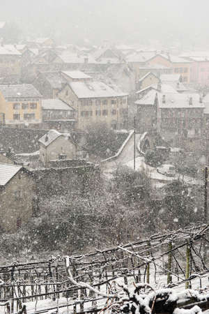 the village of Giornico under snowfall in Leventina valley on the Swiss alpsの写真素材