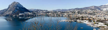 View to the bay of Lugano on Switzerland during the winter with snowのeditorial素材
