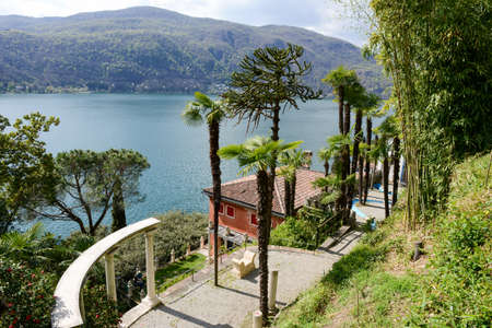 Morcote, Switzerland - 13 april 2016: Scherrer Park on Morcote, Switzerland. Called "The Garden of Wonders." a rich collection of art objects from different countries and different erasのeditorial素材