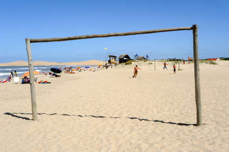 Barra de Valizas, Uruguay - 11 february 2011: people playing football on the beach of Barra de Valizas on Uruguayのeditorial素材