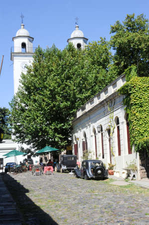 Colonia del Sacramento, Uruguay - 13 february 2011: people eating and drinking on a street restaurant of the colonial town of Colonia del Sacramento in Uruguayのeditorial素材