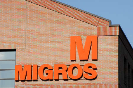 Lugano,12 november 2002 - Logo sign of Migros food store at Lugano on Switzerland
