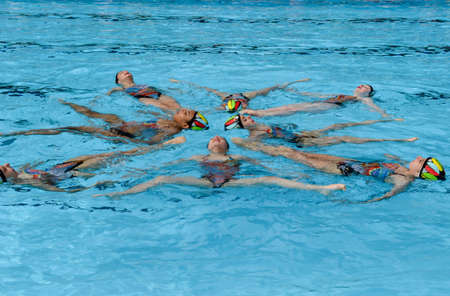 Massagno, Switzerland - 12 June 2016 - group of girls in a pool practicing synchronized swimmingのeditorial素材
