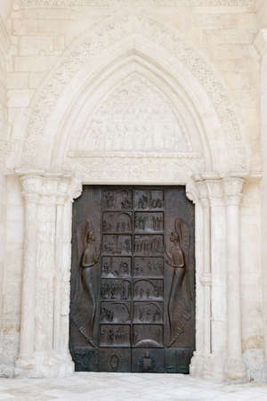 Entrance door of St Michael basilica at Monte Sant'Angelo on Puglia, Italyの写真素材