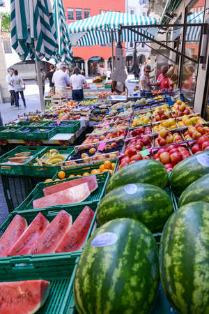 Lugano, Switzerland - 25 august 2016: people shopping at a fresh fruit and vegetables market of Lugano on the italian part of Switzerlandのeditorial素材