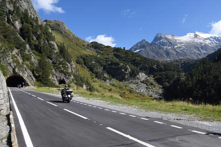 Susten pass, Switzerland - people driving them motorbike on the road to Susten pass on the Swiss alpsのeditorial素材