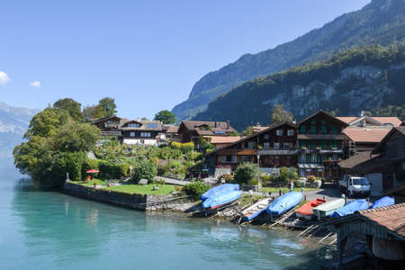 Iseltwald, Switzerland - 24 September 2016: people walking on the lake front of Iseltwald on lake Brienz, Switzerlandのeditorial素材