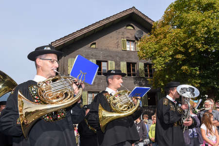 Kerns, Switzerland - 1 October 2016: People wearing traditional clothes and playing music on the streets of Kerns on the Swiss alpsのeditorial素材