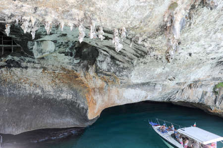 Bue Marino, Italy - 28 June 2013: people on a motorboat visiting the cave of Bue Marino on the island of Sardinia, Italyのeditorial素材