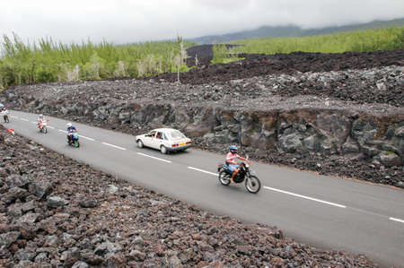La Reunion island, France - 29 December 2002: people driving them car on the road at the place of the last lava eruption on La Reunion island, Franceのeditorial素材