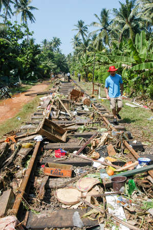 Hikkaduwa, Sri Lanka - 26 December 2004: people walking on the debris after the tsunami at Hikkaduwa in Sri Lankaのeditorial素材