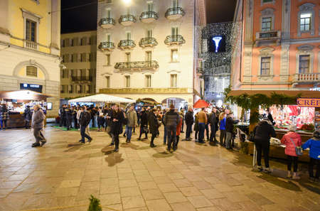 Lugano, Switzerland - 8 December 2016: people shopping on the christmas market on the central square of Lugano, Switzerlandのeditorial素材