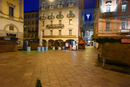 Lugano, Switzerland - 8 December 2016: woman worker cleaning the central square with the christmas market at Lugano on Switzerlandのeditorial素材