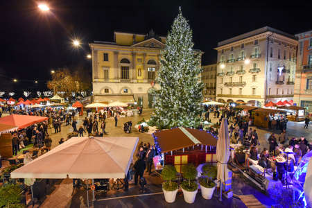 Lugano, Switzerland - 8 December 2016: people shopping on the christmas market on the central square of Lugano, Switzerlandのeditorial素材
