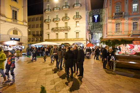 Lugano, Switzerland - 8 December 2016: people shopping on the christmas market on the central square of Lugano, Switzerlandのeditorial素材