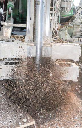 Bissone, Switzerland - 5 May 2011: drilling pile foundation at a construction of a highway at Bissone on Switzerlandのeditorial素材