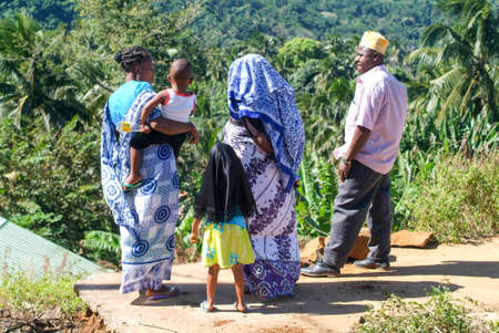 Mayotte, France - 2 June 2007: People with traditional clothes discussing at Mayotte island, France