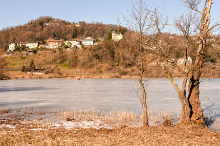 Frozen lake of Muzzano near Lugano on the italian part of Switzerlandの写真素材