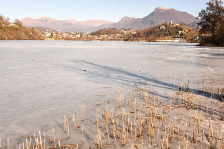 Frozen lake of Muzzano near Lugano on the italian part of Switzerlandの写真素材