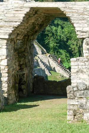 Palenque, Mexico - 22 January 2009: people walking in front of pyramid at Palenque on Chiapas in Mexicoの写真素材