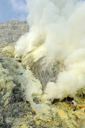 Vulcano Ijen, Indonesia - 5 February 2013: Miners with their sulfur crops climb the ijen crater on the island of Java, Indonesiaのeditorial素材