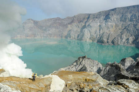 Vulcano Ijen, Indonesia - 5 February 2013: Miners with their sulfur crops climb the ijen crater on the island of Java, Indonesiaのeditorial素材