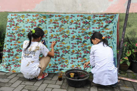 Yogyakarta, Indonesia - 29 January 2013: woman making Batik at Yogyakarta in Indonesiaのeditorial素材