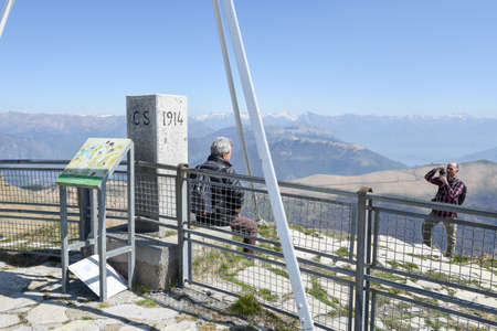 Monte Generoso, Switzerland -8 April 2017: People who enjoy the view from mount Generoso to lake Lugano and the Swiss Alpsのeditorial素材
