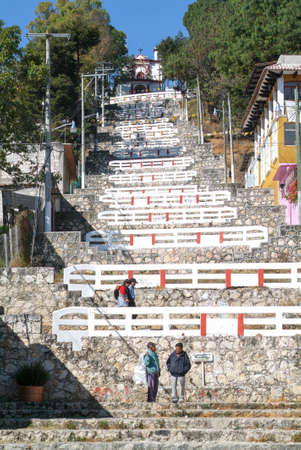 Cristobal de las Casas, Mexico - 19 January 2009: people walking on the steps in front of Catholic chapel on a hill of San Cristobal de las Casas, Mexicoのeditorial素材