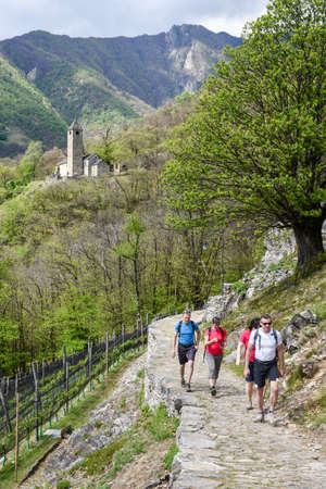 Sementina, Switzerland - 17 April 2017: people treking to the St. Bernard church at Sementina on the Swiss alpsのeditorial素材