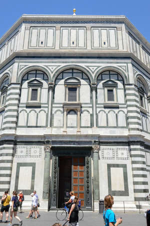 Firenze, Italy - 5 July 2017: people walking on Duomo square in front of the baptistery at Florence, Italy.のeditorial素材