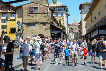 Firenze, Italy - 5 July 2017: people walking over the bridge of Ponte Vecchio in Florence on Italy.のeditorial素材