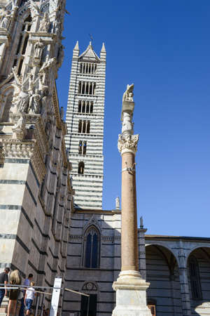 Siena, Italy - 6 July 2017: people walking on front of the cathedral at Siena, Italyのeditorial素材