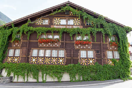Burglen, Switzerland - 3 August 2017: the typical chalet at Burglen on canton Uri in the Swiss alpsのeditorial素材