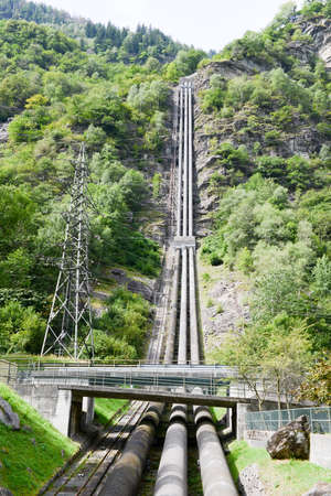 Power station making Electricity from a hydroelectric plant on leventina valley in the Swiss alpsの写真素材