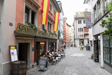 Zurich, Switzerland - 11 July 2017: people eating and drinking on a spanish restaurant in the old...