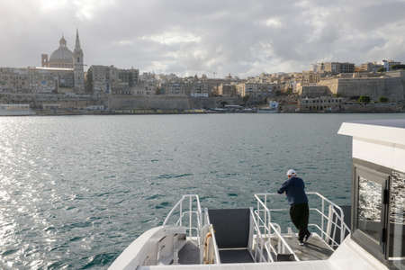 La Valletta, Malta - 31 October 2017: man on the ferry leading to La Valletta on Maltaのeditorial素材