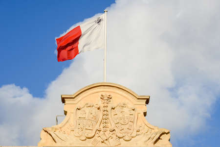 Malta national flag on Auberge de Castille at La Valletta, Maltaの写真素材