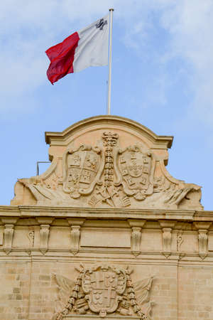 Malta national flag on Auberge de Castille at La Valletta, Maltaの写真素材