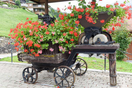 Grist mill grinding wheel for corn with flower decorationの写真素材