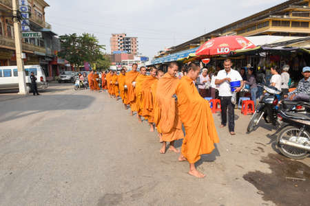 Battambang, Cambodia - 15 January 2018: monks during food gathering at Battambang on Cambodiaのeditorial素材