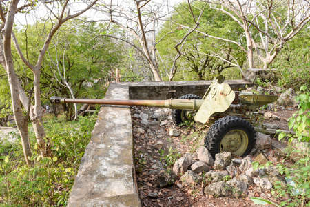 Old artillery piece of the red Khmer on mount Phnom Sampeau at Battambang, Cambodiaのeditorial素材