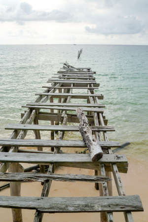 Old pier at Sunset beach of Koh Rong Sanloem island on Cambodiaの写真素材
