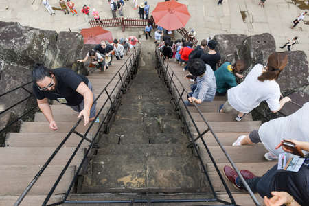 Siem Reap, Cambodia - 10 January 2018: people climbing to Angkor Wat temple at Siem Reap in Cambodia.のeditorial素材