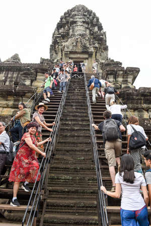 Siem Reap, Cambodia - 10 January 2018: people climbing to Angkor Wat temple at Siem Reap in Cambodia.のeditorial素材