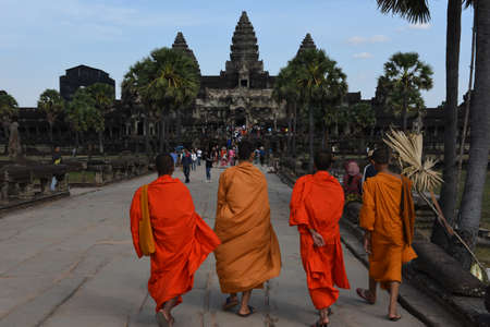 Siem Reap, Cambodia - 12 January 2018: young monks walking to Angkor Wat temple at Siem Reap in Cambodia.のeditorial素材