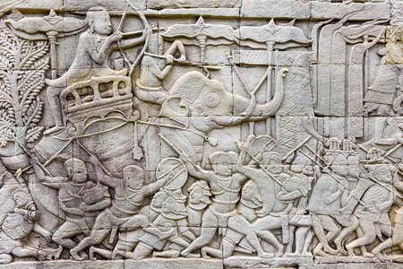 Bas relief sculpture, elephant charging into battle between the Cham and Khmer. Bayon Temple, Angkor Thom, Siem Reap, Cambodiaの写真素材