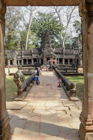Siem Reap, Cambodia - 12 January 2018: people visiting on walking Ta Prohm temple at Angkor Wat complex, Siem Reap, Cambodiaのeditorial素材